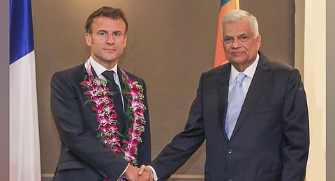 Sri Lankan President Ranil Wickermesinghe shakes hand with his French counterpart Emmanuel Macron during a meeting in Colombo, Sri Lanka. (Photo | AP)