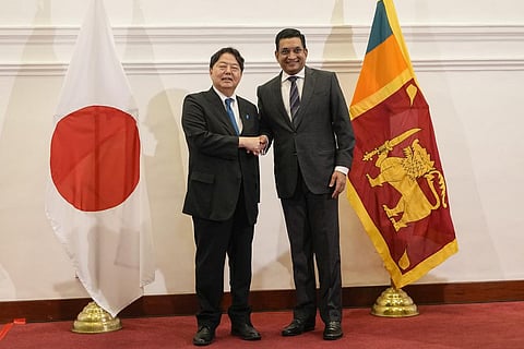 Japanese foreign minister Yoshimasa Hayashi, left, shakes hands with his Sri Lankan counterpart Ali Sabry after their meeting in Colombo. (Photo | AP)