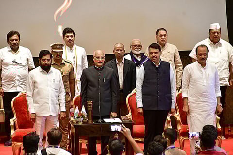 Maharashtra Governor Ramesh Bais with CM Eknath Shinde, Deputy CMs Devendra Fadnavis and Ajit Pawar, and newly sworn-in State Cabinet ministers, in Mumbai, Sunday, July 2, 2023. (Photo | PTI)