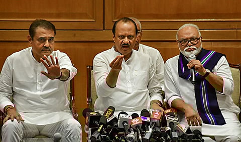 Newly sworn-in Maharashtra Deputy CM Ajit Pawar (C) with NCP leaders Chhagan Bhujbal (R) and Praful Patel during a press conference, in Mumbai, Sunday, July 2, 2023. (Photo | PTI)