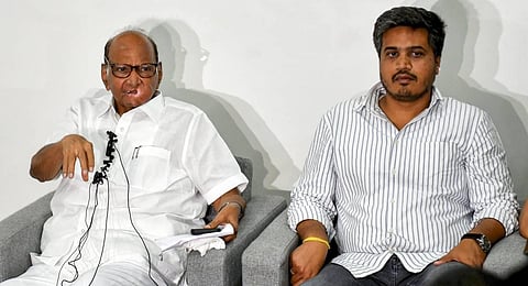 NCP President Sharad Pawar with party MLA Rohit Pawar speaks during a press conference at his residence, in Pune, Sunday, July 2, 2023. (Photo | PTI)