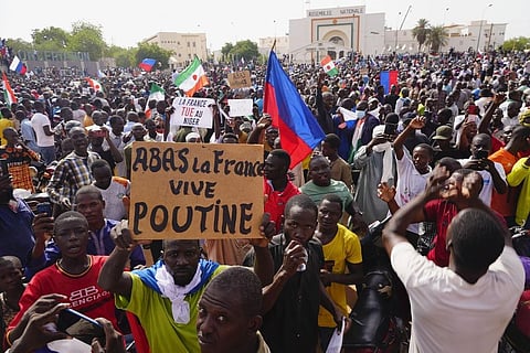 Nigeriens participate in a march called by supporters of coup leader Gen. Abdourahmane Tchiani in Niamey. (Photo | AP)