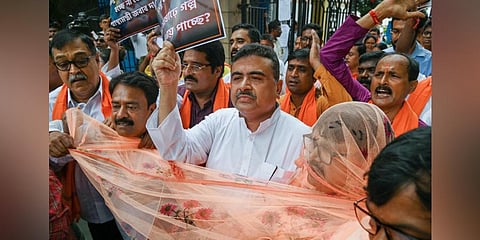 Leader of Opposition in West Bengal Assembly Suvendu Adhikari with other BJP MLAs stage a walkout from the assembly over rising dengue cases. (Photo | PTI)