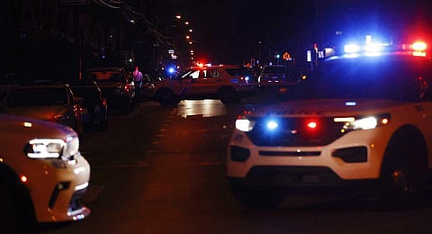 Philadelphia police stand at the intersection of 56th Street and Kingsessing Avenue after multiple people were shot in Southwest Philadelphia, late Monday, July 3, 2023. (AP)