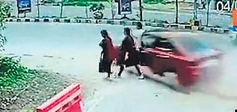 A screengrab of the accident caught on CCTV cameras shows the speeding car about to hit the victims at Sun City in Hyderabad early on Tuesday