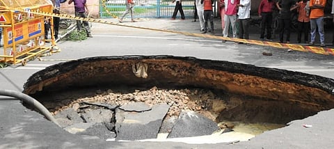 A large portion of a road in west Delhi’s Janakpuri has caved in after a sewer line burst. (Photo | Shekar Yadav)