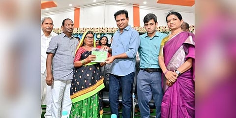 BRS working president and Minister KT Rama Rao distributing title deeds for 2,858 acres to 1,614 beneficiaries in Rajanna Sirisilla. (Photo | Twitter)