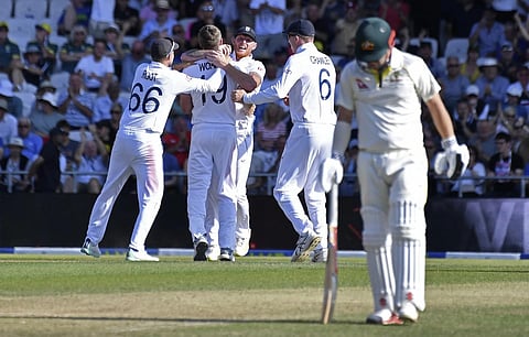 England's Chris Woakes, second left, celebrates with teammates after the dismissal of Australia's Usman Khawaja during the second day of the third Ashes test match, July 8, 2023. (Photo | AP)