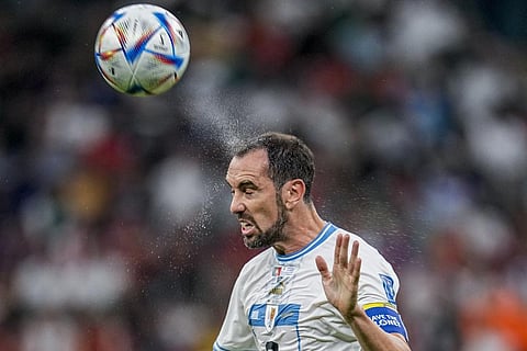 FILE - Uruguay's Diego Godin heads for the ball during the World Cup group H soccer match between Portugal and Uruguay, at Lusail Stadium in Lusail, Qatar, Nov. 28, 2022. (Photo | AP)