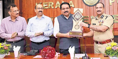 State Police Chief Sheikh Darvesh Saheb handing over a memento to DGP Tomin Thachankary, who retired from service on Monday. Intelligence chief T K Vinod Kumar and ADGP Balram Kumar Upadhyaya are also