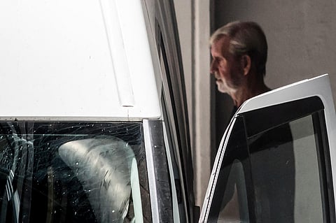 Retired British miner David Hunter, convicted of killing his terminally ill wife to relieve her suffering, enters a police van as he leaves the court, in Paphos, Cyprus, on July 27, 2023. (AFP)