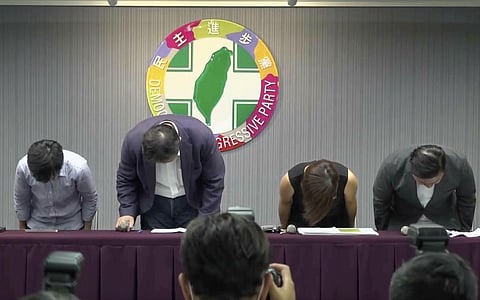 Hsu Li-ming, Secretary general of the Democratic Progressive Party bowed at a news conference offering an apology to victims who say they were sexually harassed and the public in Taipei. (Photo | AP)