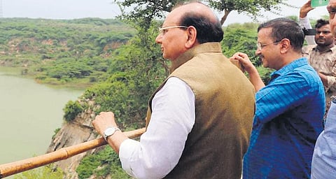 Chief Minister Arvind Kejriwal and L-G VK Saxena pose for a photograph during a  visit to Asola Bhatti Wildlife Sanctuar. (Photo| Express)