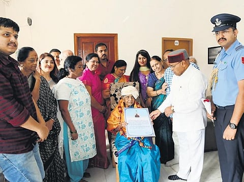 Governor Thaawarchand Gehlot honours freedom fighter Shankutala in Bengaluru on Wednesday | Express
