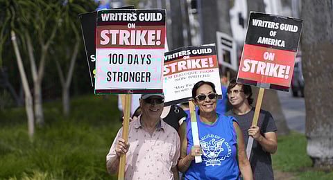 Picketers demonstrate outside Netflix studios. (Photo | AP)