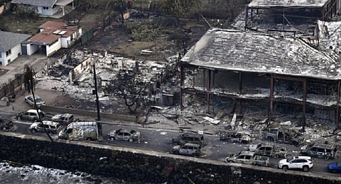 An aerial image taken on August 10, 2023 shows destroyed homes, cars and buildings burned to the ground in Lahaina in the aftermath of wildfires in western Maui, Hawaii. (Photo |AFP)