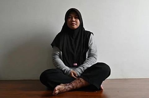 'Let me be the last to suffer':  Siti Khotimah (Photo | AFP)