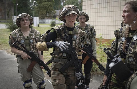 Volunteers practice during military training for civilians close to Kyiv