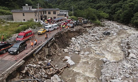 An aerial photo shows the aftermath of a mudslide in Weiziping village of Luanzhen township. (Photo |AP)