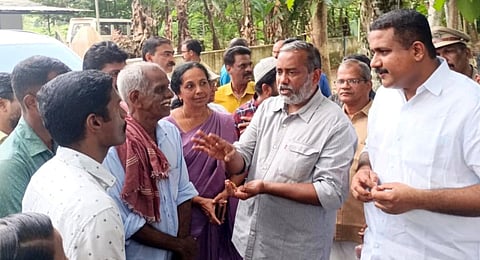 Agriculture Minister P Prasad visits the destroyed farm of farmer Thomas in Varapetty. Antony John MLA, farmer K.O. Thomas and his family members are nearby| Express Photo