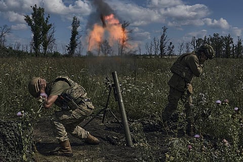 Ukrainian soldiers fire a mortar towards Russian positions at the front line, near Bakhmut, Donetsk region, Ukraine. (Photo | AP)
