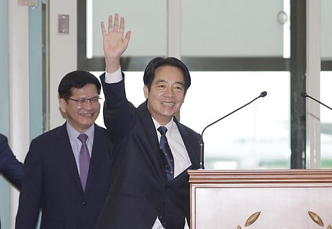 Taiwanese Vice President William Lai waves to the media as he departs for Paraguay at Taoyuan International Airport in Taoyuan, Taiwan. (Photo | AP)