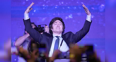 Javier Milei, presidential candidate of the Liberty Advances coalition, raises his arms at his campaign headquarters in Buenos Aires,  Aug. 13, 2023. (Photo | AP)