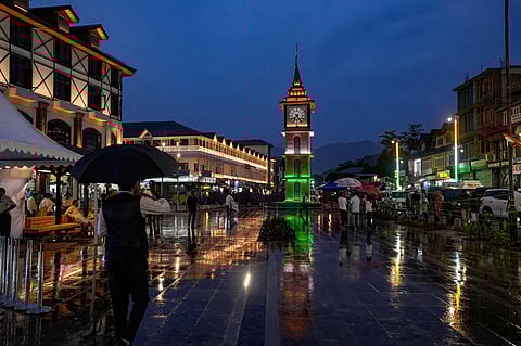 The historic clock tower in Srinagar's Lal Chowk is illuminated with the colours of the national flag. (Photo | PTI)