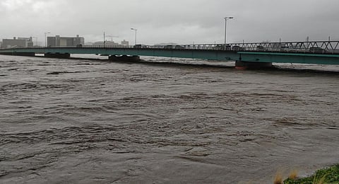 The Sendai River swollen due to heavy rains is pictured in the city of Tottori. (Photo | AFP)