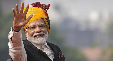 Prime Minister Narendra Modi waves after delivering his speech at 17th century Mughal-era Red Fort monument on country's Independence Day in New Delhi.(Photo | AP)