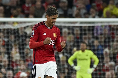 Manchester United's Raphael Varane celebrates after scoring his side's opening goal during the English Premier League soccer match between Manchester United and Wolverhampton. (Photo | AP)