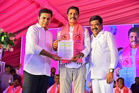 Ministers KT Rama Rao and Vemula Prashant Reddy hand over the Government issued sanction of Rs 45 core for development works in the Yellareddy assembly constituency. (Photo | Express)
