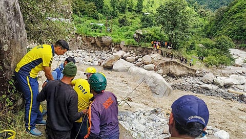 Uttarakhand SDRF personnel rescue people trapped in the Madmaheshwar Valley, who were trapped due to heavy rains, in Rudraprayag on Wednesday. (Photo | ANI)