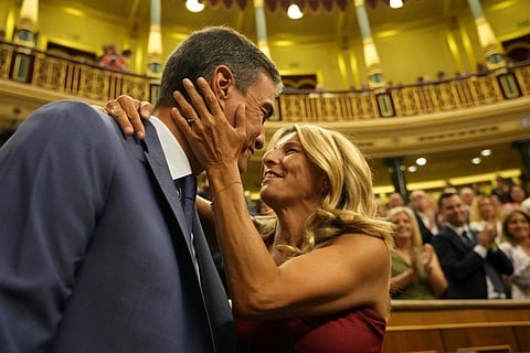Acting Prime Minister Pedro Sánchez is embraced by Yolanda Diaz before the start of a voting session at the Spanish parliament in Madrid, Spain, August 17, 2023. (Photo | AP)