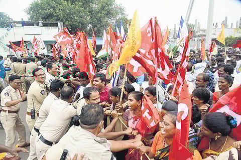 Protesters scuffle with police during bandh at Gangavaram port on Thursday I express
