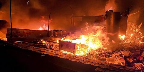 Flames rise from shops and other structures set ablaze by miscreants during fresh violence after Monday's attack on a procession in adjoining Nuh district, at Badshahpur area in Gurugram (Photo | PTI