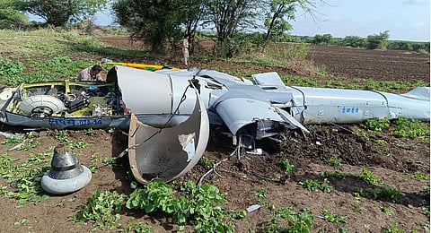 Wreckage of an unmanned aerial vehicle (UAV) developed by the Defence Research Development Organization (DRDO) following a crash at an agriculture field, in Chitradurga district.(Photo |PTI)