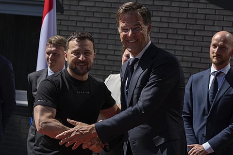 Ukrainian President Volodymyr Zelenskyy, left, is greeted by Dutch caretaker Prime Minister Mark Rutte in Eindhoven, Netherlands. (Photo | AP)