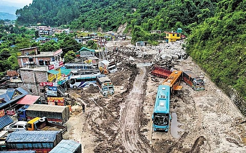 Vehicles stuck in debris following a recent cloudburst in Mandi on Sunday. (Photo| PTI)