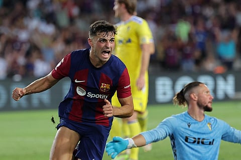 Barcelona's Spanish midfielder Pedri celebrates scoring his team's first goal during the Spanish Liga football match between FC Barcelona and Cadiz CF. (Photo | AFP)