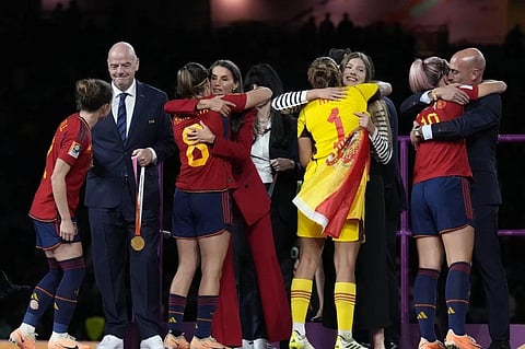 From left, FIFA President Gianni Infantino, Queen Letizia, Princess Infanta Sofia President of Spain’s soccer federation, Luis Rubiales, hug Spanish players, in Australia, Aug. 20, 2023. (Photo | AP)