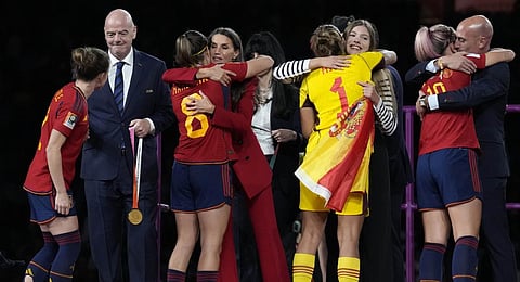 FIFA President Gianni Infantino, Queen Letizia, Spain's Princess Infanta Sofia President of Spain's soccer federation, Luis Rubiales, hug Spain's players following their win.(Photo | AP)