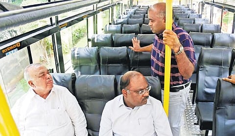 Transport Minister Ramalinga Reddy and officials inspect the upgraded  non-premium bus in Bengaluru on Monday | express