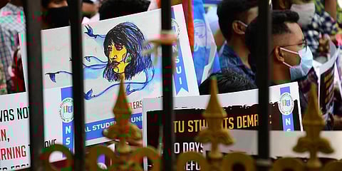 Students and members of NSUI display placard condemning the arrest of the activist Disha Ravi. (Photo | Shriram B, EPS)