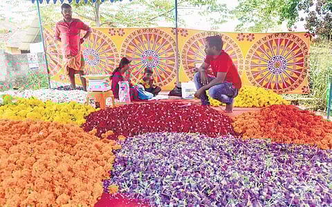 Vendors arranging flowers at a market in Kakkanad. (Photo | A Sanesh)