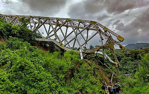 Locals at the site after an under-construction railway bridge at Sairang area collapsed, near Aizawl, Mizoram (Photo | PTI)