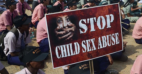 School students participate in an awareness campaign against child sex abuse.
