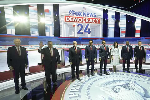 (L to R) GOP Presidential candidates Asa Hutchinson, Chris Christie, Mike Pence, Ron DeSantis, Vivek Ramaswamy, Nikki Haley, Tim Scott, and Doug Burgum stand on stage, Aug 23, 2023. (Photo | AFP)