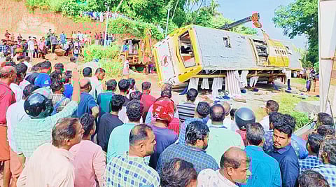 The bus involved in the accident being lifted using a crane. (Photo | Express)