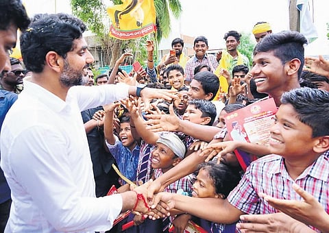 Lokesh interacts with students during his Yuva Galam yatra on Thursday I Express